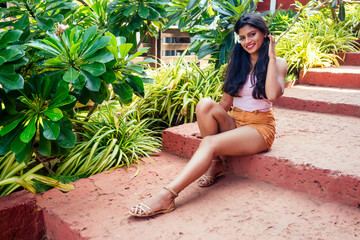 Closeup headshot portrait of attitude confident smiling happy pretty young woman background of...