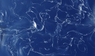 Many White thin Swirls and Waves in a blue Liquid