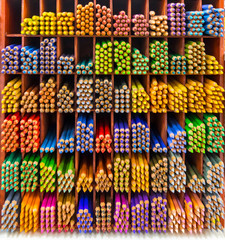 Colourful watercolor pencils on the shelves