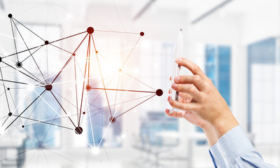 Business and technology concept with networking grid and man using device
