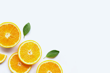 Fresh orange citrus fruits with leaves on white background.