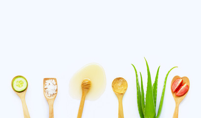 Natural ingredients for homemade skin care on white.