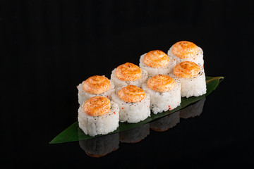 Japanese rolls, sushi on a black background