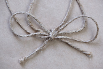 Packing tape tied in a knot in a bow