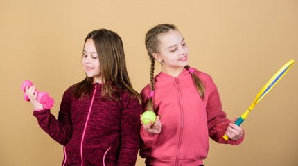 Summer fun. Happy children with sport equipment. Sport success. Little girl. Fitness barbell. gym workout of teen girls. Tennis racket and ball for activity. I choose you for my team