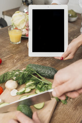 Couple with tablet template in kitchen