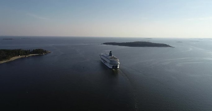  Summer evening aerial video of Helsinki Baltic Sea Finnish Bay lagoon area. Cruise liner ship depart to Tallinn. Near capital of Finland Suomi, northern Europe