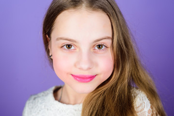 Naklejka premium Adding some sparkle for a special occasion. Beautiful small child model with long blond hair. Little beauty model wearing colorful makeup. Makeup model with adorable look. Kids model agency