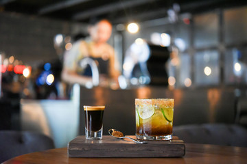 Black coffee and ice lemon tea on wood table at coffee shop