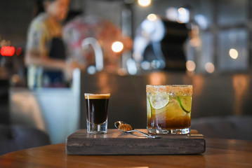 Black coffee and ice lemon tea on wood table at coffee shop