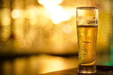 glass of beer on a black background