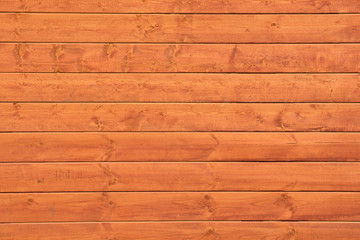 The texture of weathered wooden wall. Aged wooden plank fence of horizontal flat boards