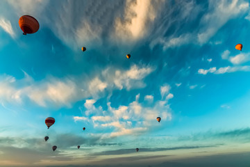 Bottom up view of hot air balloons flying over Cappadocia