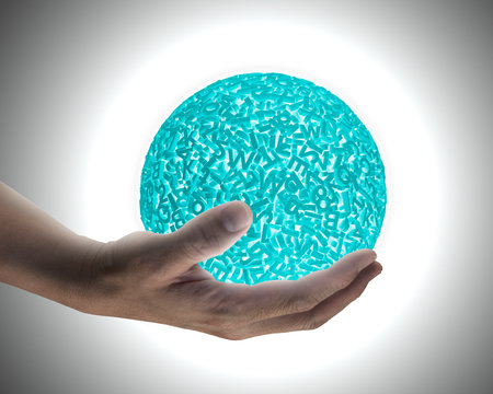 Big data concept. Male hand holding self-illuminated green ball of huge amount 3d letters and numbers with white light.