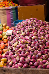 Purple fruits on a street market stand in Marrakesh, Morocco