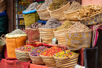 Nuts, herbs and other dried products on a street market stand in Marrakesh, Morocco
