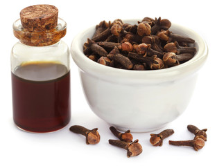 Fresh clove with oil in a jar