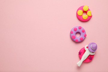Plasticine people relaxing on inflatable lilo in pool. Cartoon summer relaxing and holidays.