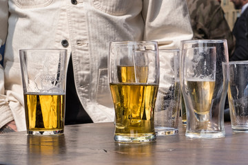 Pint beer glasses half full