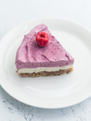 Raw cashew cake with raspberries. Sugar, milk and gluten-free dessert