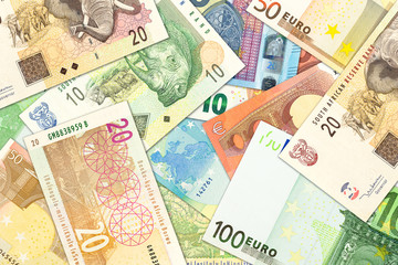 some south african rand banknotes and euro banknotes indicating trade relations
