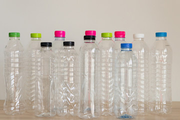 set of many plastic bottle on wood table, recycling concept