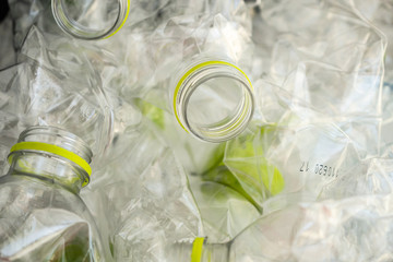 Crushed plastic bottles for recycling abstract background