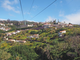 view of the of houses and market gardens of monte from the cable car running up the mountain from...