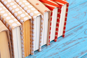 books on blue wooden background