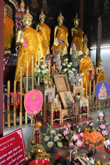 statues of buddha in a buddhist temple (Wat Phra That Haripunchai) in Lamphun (Thailand)