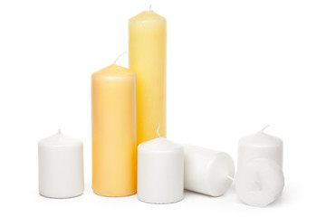 different sized candles on a white background
