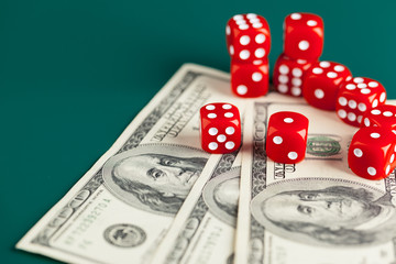 Playing Dices and Stack of American Dollars Bills.