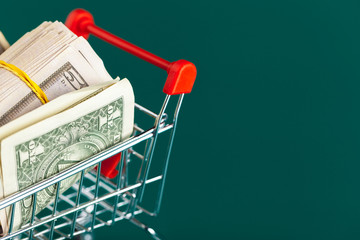 Shopping cart with dollars inside
