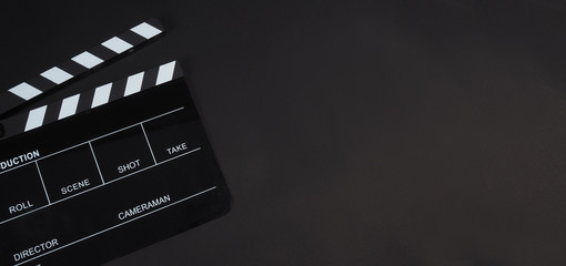 Fototapeta na wymiar Black Clapperboard or clap board or movie slate use in video production ,film, cinema industry on black background.