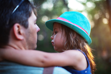 Cute little girl hugging her father