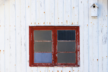 Nesting box on old wooden walls on Fr&oslash;ya in Norway