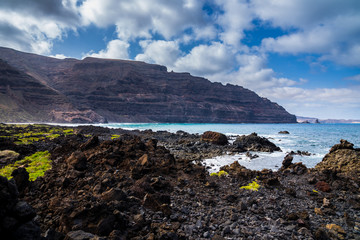 Spain, Lanzarote, Volcanic islands north coast of impressive famara cliff and craggy lava fields
