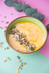 homemade Warm pumpkin soup with pumpkin seeds and cream