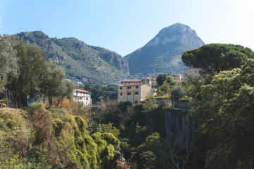 Fototapeta na wymiar Road near a mountains in the town, small village, travel concept, beautiful pine tree, hotel, hostel, camping, Sorrento, Italy