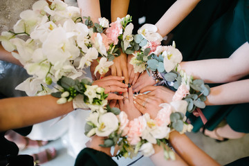 Bridesmaids bridesmaids from flowers on their hands