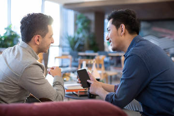 Young abroad students using smart phone