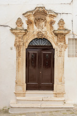 Fototapeta na wymiar Italy, Ostuni, gate of an ancient building in the historic center