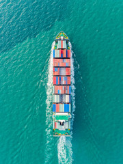 Aerial top view container ship on the seaa full speed delivering container for logistics, import export, shipping or transportation. - 264172897