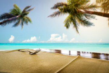 table background of free space for your decoration and summer background of beach sea and palms 