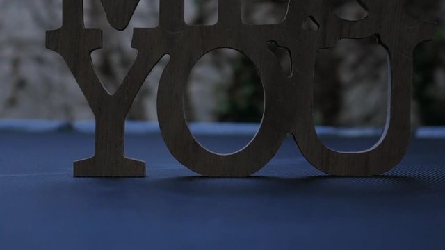 Moody shot as a glass ball rolling by a You sign, conceptual shot of self-awareness