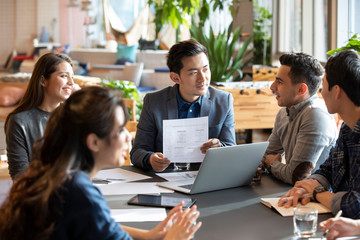 Young abroad students talking with teacher
