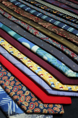 A row of different coloured and patterned ties