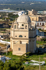 Italy, Ostuni, view of the church in the countryside among the olive trees.