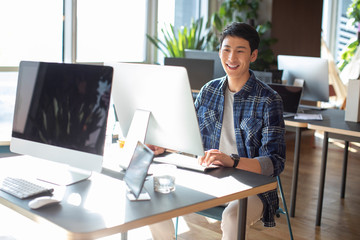 Young college student using computer