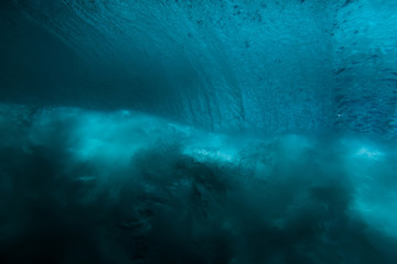 Fototapeta na wymiar Wave underwater. Blue ocean in underwater